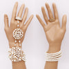 Unique Circular Design Crystal Rhinestone And Simulated White Pearl Stretch Bracelet Ring Hand Chain (Cream Gold Tone)
