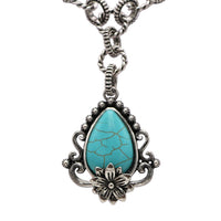 Vintage Style Turquoise Howlite Pendant Necklace, 18 Inch Silver Tone Chain, Floral Design with Ornate Frame