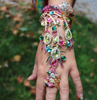 Vibrant And Colorful Statement Making Crystal Rhinestone 3D Peacock On Gold Tone Stretch Bangle Bracelet With Attached Ring Hand Chain Combination